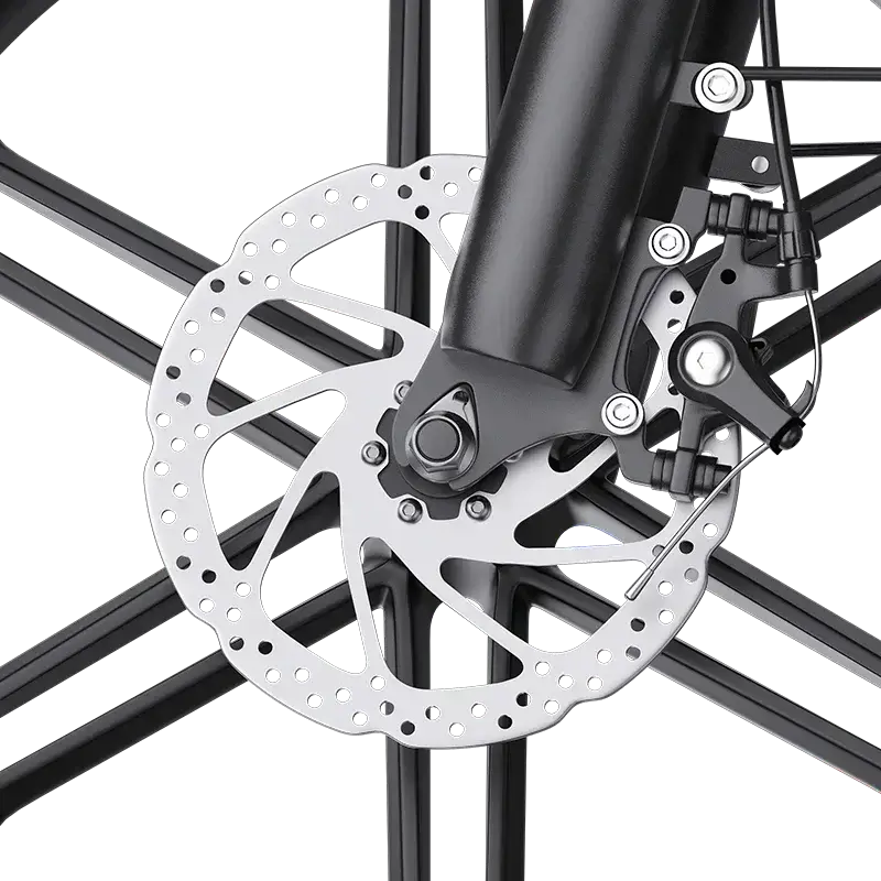 Close-up of a bicycle disc brake with a perforated rotor and black caliper on black spokes