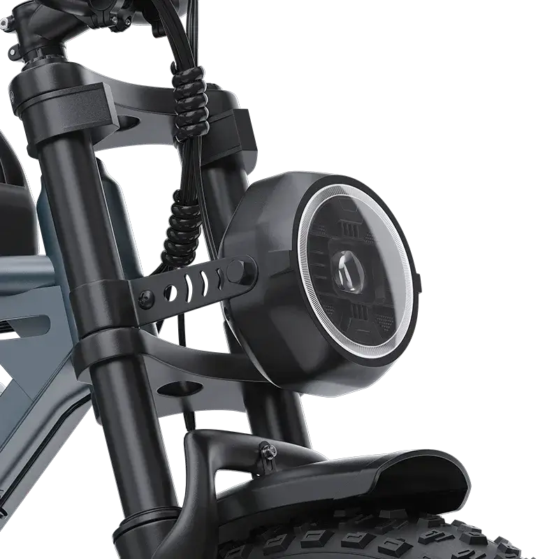 Close-up of electric scooter front suspension and round LED headlight with black frame and thick tire